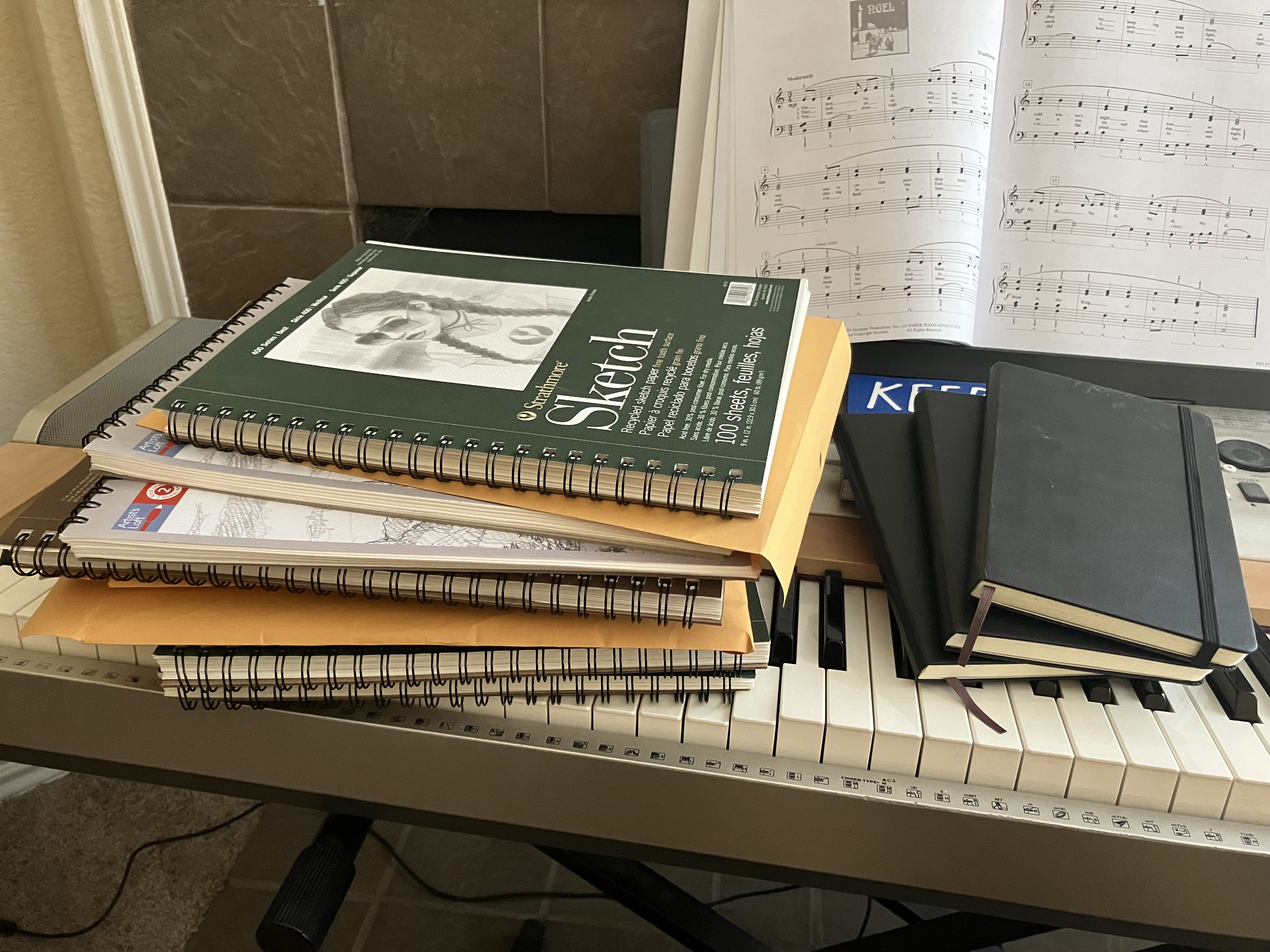 Stack of sketchbooks