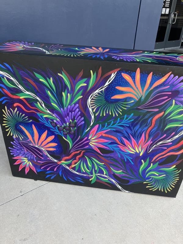 Back View. Beautiful dark design with a colorful, floral pattern.